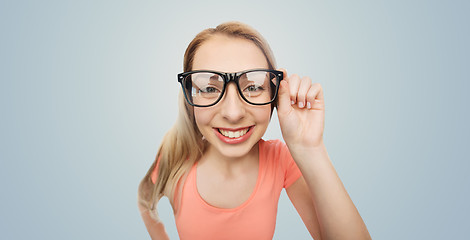 Image showing happy young woman or teenage girl in eyeglasses