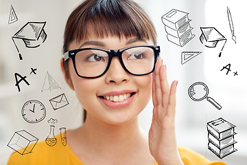 Image showing happy asian young woman in glasses at home