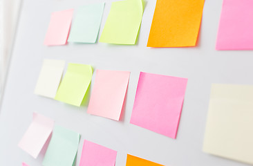 Image showing close up of blank paper stickers on white board