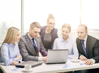 Image showing business team with laptop having discussion