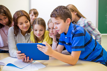 Image showing group of kids with teacher and tablet pc at school