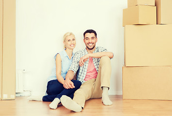 Image showing couple with cardboard boxes moving to new home