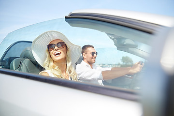 Image showing happy man and woman driving in cabriolet car