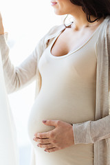 Image showing close up of happy pregnant woman with big belly