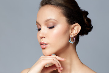 Image showing close up of beautiful woman face with earring