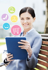 Image showing smiling business woman with tablet pc in city