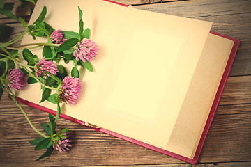 Image showing album with open pages and blossom clover. mock up