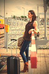 Image showing beautiful middle aged woman traveller with suitcase