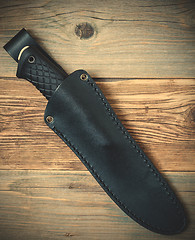 Image showing hunting knife in a leather scabbard