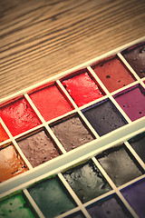 Image showing watercolor paint-box. selective focus