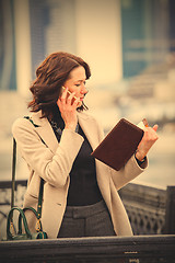 Image showing Woman talking on cell phone