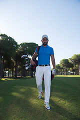 Image showing golf player walking