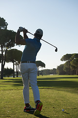 Image showing golf player hitting shot