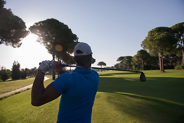 Image showing golf player hitting shot