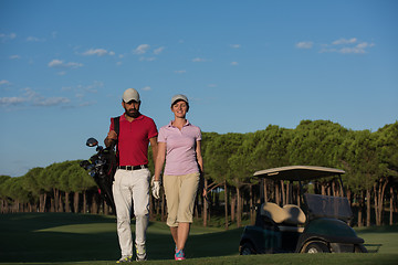 Image showing couple walking on golf course