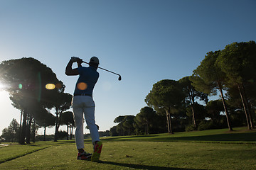 Image showing golf player hitting shot