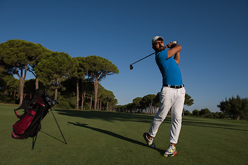 Image showing golf player hitting shot