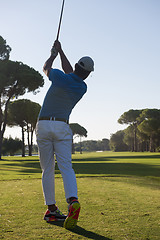 Image showing golf player hitting shot