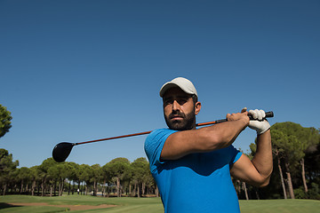 Image showing golf player hitting shot