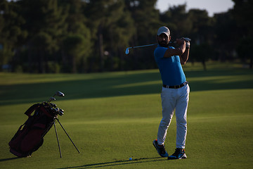 Image showing golfer hitting long shot