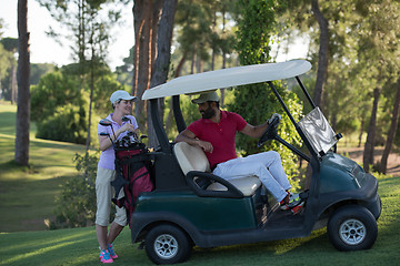 Image showing couple in buggy on golf course