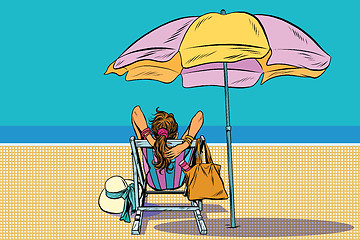 Image showing Girl in a deckchair on the beach