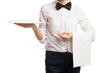 Image showing Close-up of elegant waitress holding tray and towel