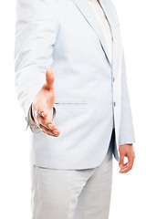 Image showing Close up of businessman hand extended to handshake isolated on white 