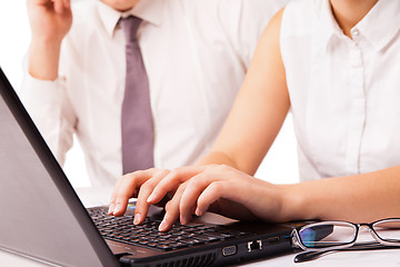 Image showing Businessman and businesswoman working on laptop isolated