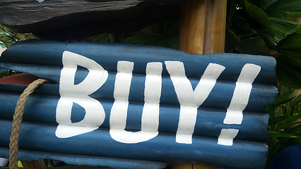 Image showing Blue buy sign on wooden block 