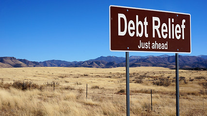 Image showing Debt Relief brown road sign