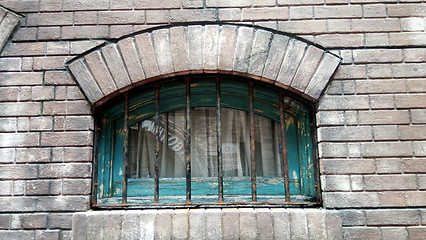 Image showing Old wood window on concrete wall