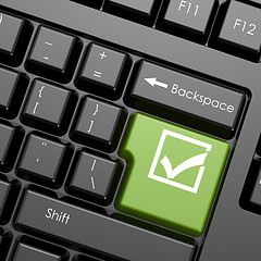 Image showing Green enter button with check mark on black keyboard, isolated