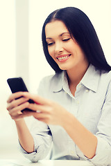 Image showing businesswoman or student with smartphone