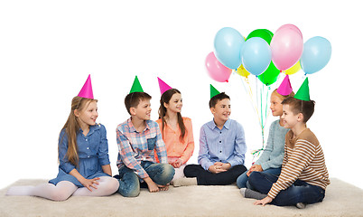 Image showing happy smiling children in party hats on birthday