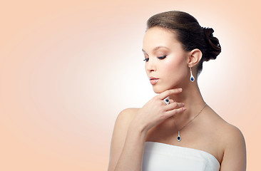 Image showing beautiful woman with earring, ring and pendant