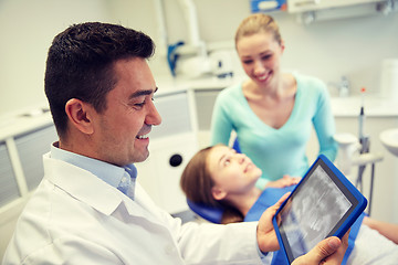 Image showing dentist with x-ray on tablet pc and patient girl