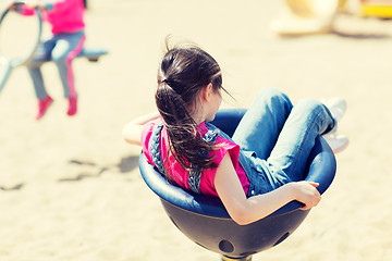 Image showing close up of girl playing on children playground