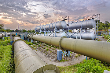 Image showing Oil and gas industry refinery factory at sunset