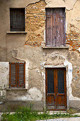 Image showing brown door  europe    in  the milano   window closed brick grass