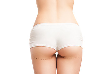Image showing Back view of woman in panties with outlines on buttocks