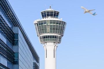 Image showing Munich international airport control tower and departing taking off