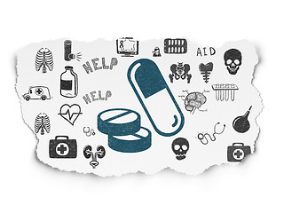 Image showing Medicine concept: Pills on Torn Paper background