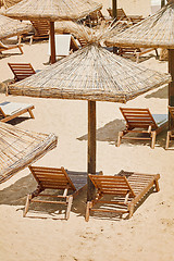 Image showing Umbrellas and Sun Loungers