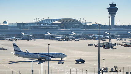 Image showing Israeli passenger plane El Al Airlines accompanied by police veh