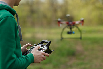 Image showing Man controling a drone.