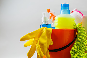 Image showing Bucket with cleaning items on light background