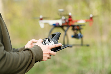 Image showing Man controling a drone.