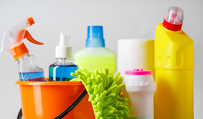 Image showing Bucket with cleaning items on light background