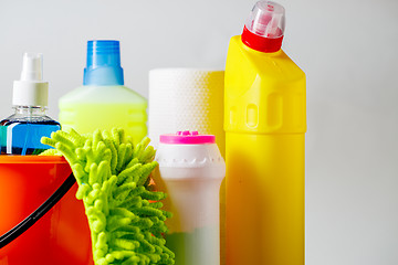 Image showing Bucket with cleaning items on light background